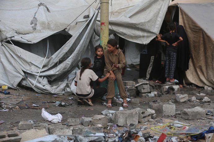 August 16, 2025, Gaza City, Gaza Strip, Palestinian Territory: Palestinians assess the damage in the aftermath of an overnight Israeli strike that hit Al-Majda Wasila School, which was sheltering displaced people, in Gaza City, August 16, 2025