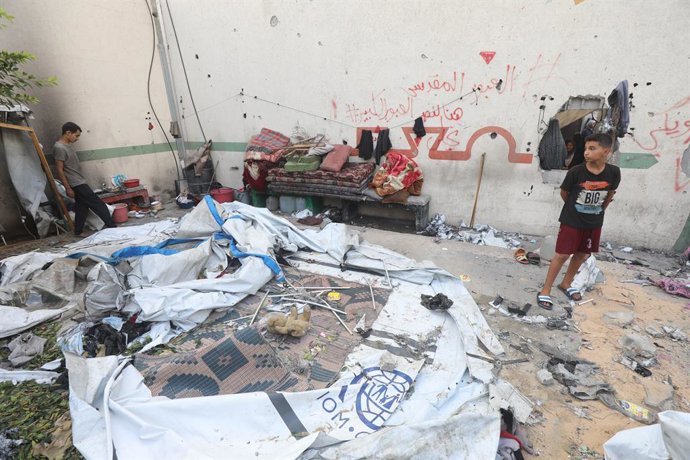 August 16, 2025, Gaza City, Gaza Strip, Palestinian Territory: Palestinians assess the damage in the aftermath of an overnight Israeli strike that hit Al-Majda Wasila School, which was sheltering displaced people, in Gaza City, August 16, 2025