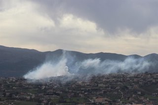 KHIAM, March 28, 2025  -- The photo shows the smoke caused by Israeli artillery shelling in Khiam, Lebanon, after two rockets were fired from Lebanon into northern Israel on March 28, 2025. A Lebanese security source told Xinhua that Israeli artillery was