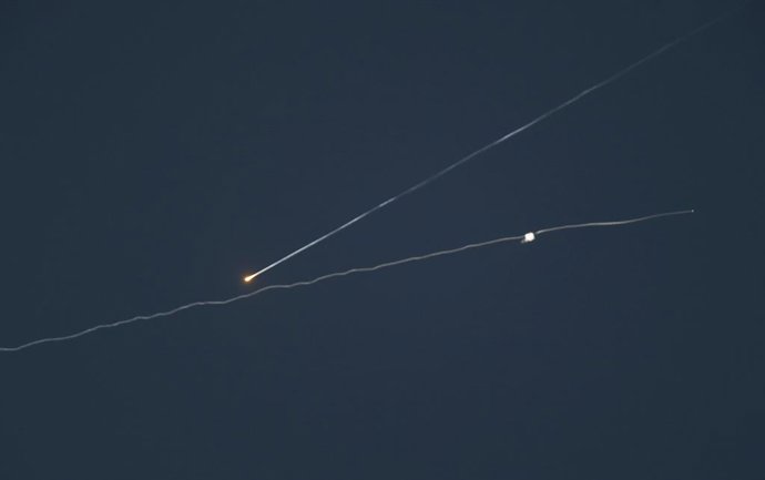 HEBRON, June 11, 2025  -- Missile traces and smoke are seen after Israeli army likely intercepted missiles fired from Yemen, in Hebron, southern West Bank, on June 10, 2025.