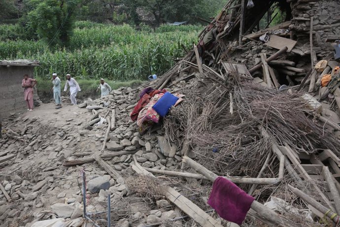 KUNAR, Sept. 2, 2025  -- People check the ruins at the earthquake-hit area in Nurgal district of Kunar province, Afghanistan, Sept. 1, 2025. The death toll from the powerful earthquake that struck eastern Afghanistan has climbed to 1,124, with 3,251 other
