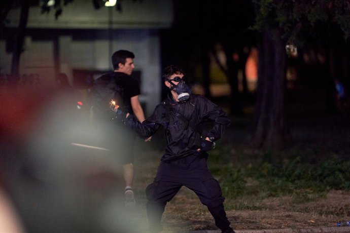 August 16, 2025, Belgrade, Vojvodina province, Serbia: Demonstrators clashed with riot police in Belgrade as tear gas was used during days of anti-government protests. A protester throws a firecracker at a police cordon.