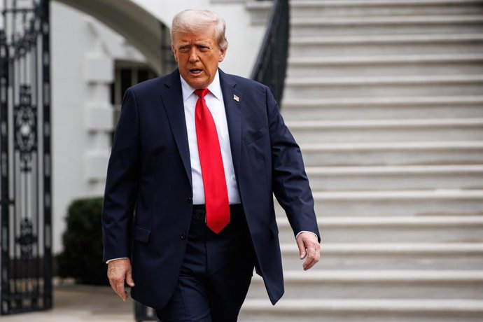 September 7, 2025, Washington, District Of Columbia, USA: United States President Donald J Trump walks out of the South Portico of the White House towards the gathered press before departing in Marine One from the South Lawn on September 7, 2025 in Washin