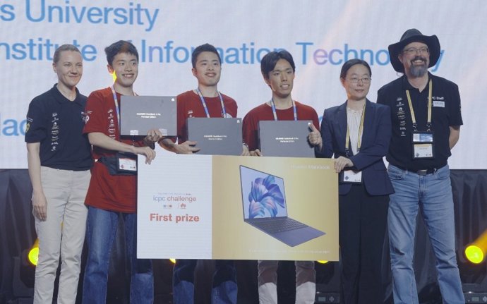 The Tokyo trio celebrating victory in the ICPC Challenge