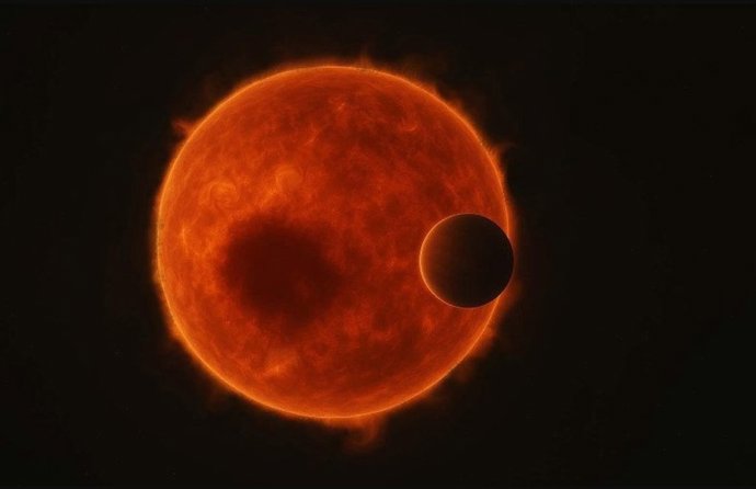 Impresión artística del sistema TOI-3884: el superneptuno TOI-3884b pasando frente a la estrella enana roja TOI-3884, que alberga una gran mancha estelar.