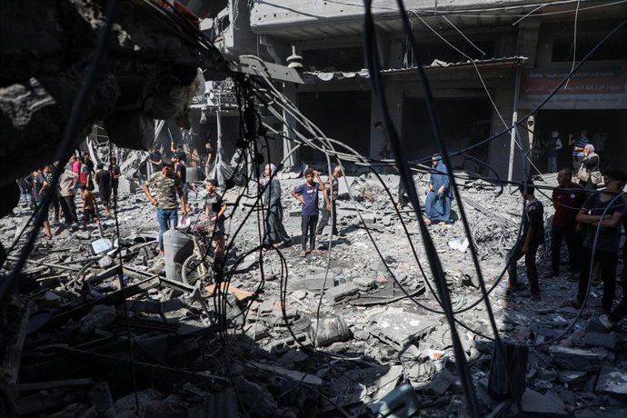 GAZA, Sept. 11, 2025  -- Palestinians inspect the damage to several houses inside the Shati refugee camp, west of Gaza City, after an Israeli airstrike, Sept. 11, 2025.