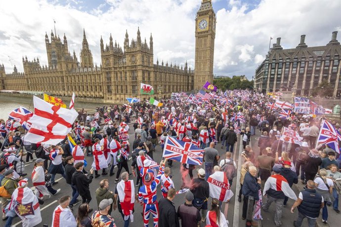 September 13, 2025, London, London, UK: London, UK. A Unite the Kingdom march and rally, organised by Stephen Yaxley Lennon also known as Tommy Robinson, takes place on Westminster Bridge. Supporters of Robinson gather in central London to take part in th