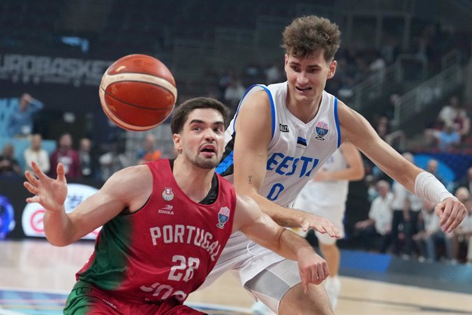 RIGA, Sept. 4, 2025  -- Henri Drell (R) of Estonia vies with Rafael Lisboa of Portugal during the FIBA EuroBasket 2025 group A match between Estonia and Portugal in Riga, Latvia, on Sept. 3, 2025.
