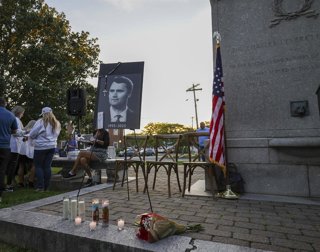 September 15, 2025, Goshen, New York, USA: Flowers and candle gathered at the base of the posted commemorating CHARLIE KIRK during the Vigil for Charlie held in Goshen, NY.