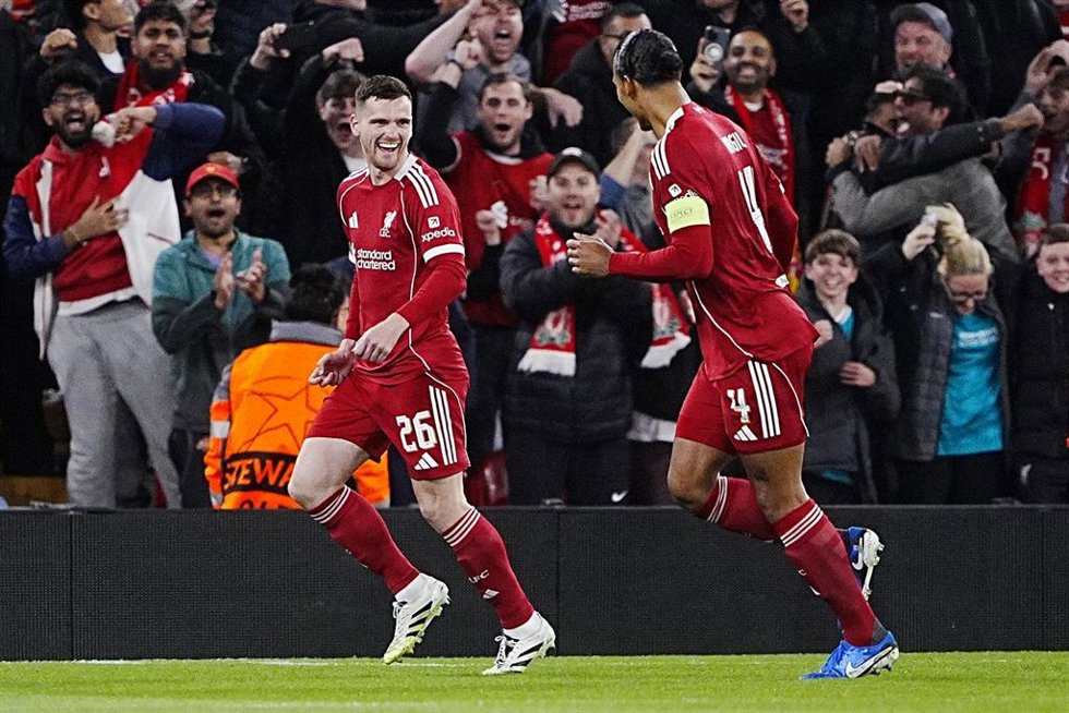 17 September 2025, United Kingdom, Liverpool: Liverpool's Andrew Robertson (L) celebrates his side's first goal with Virgil van Dijk duringthe UEFA Champions League soccer match between Liverpool and Atletico Madrid at the Anfield. Photo: Peter Byrne/P