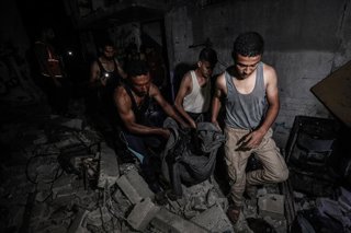 September 18, 2025, Bureij, Gaza Strip, Palestinian Territory: Civil defense teams and residents of the region carry out a search and rescue operation after Israeli attacks in Al-Bureij refugee camp, Some buildings were completely destroyed in the attack,