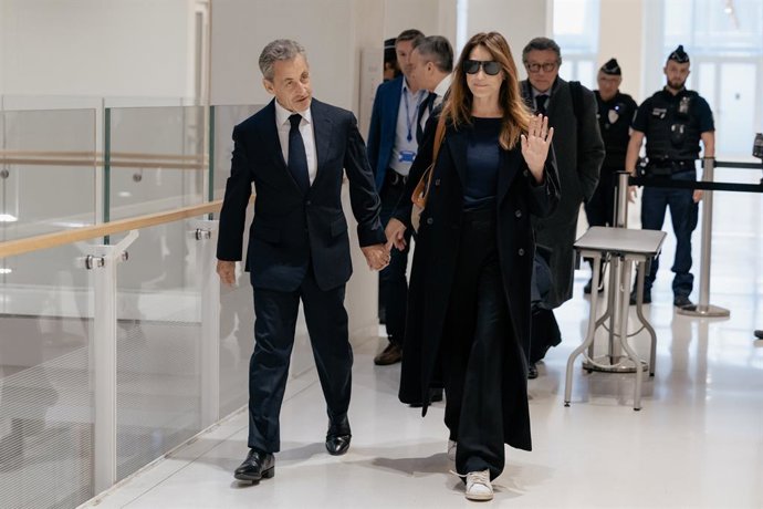 September 25, 2025, Paris, France, France: Former French president Nicolas Sarkozy with his wife Carla Bruni arrives for the verdict in his trial for illegal campaign financing from Libya for his successful 2007 presidential bid, at the Tribunal de Paris 