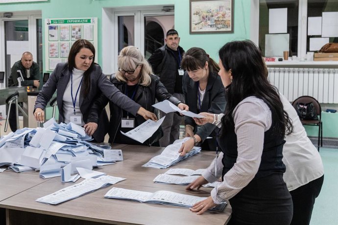 September 28, 2025, Chisinau, Moldova: Several election officials verify and count the ballots after polls close at the Spiru Haret Squiruminet Lyceum polling station in Chisinau during the Moldova's parliamentary election.