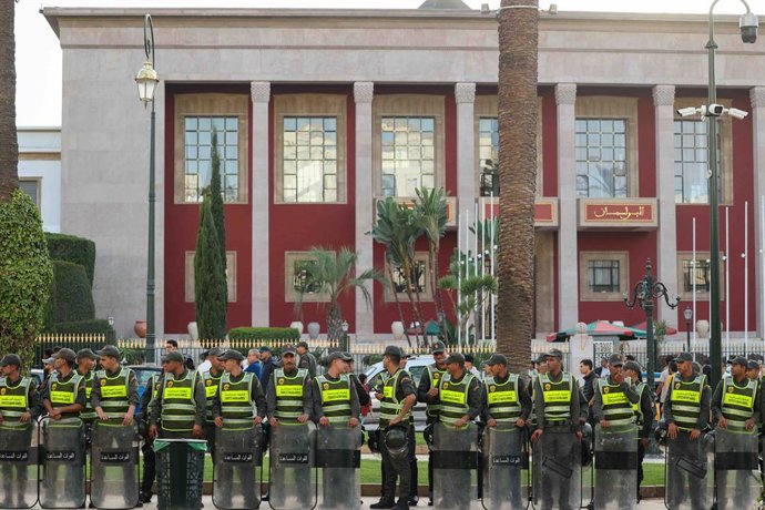 RABAT, Sept. 29, 2025  -- Security forces stand guard in front of the Moroccan parliament building during a demonstration demanding for better public services in Rabat, Morocco, Sept. 28, 2025. Young people took to the streets in downtown Rabat on Sunday 