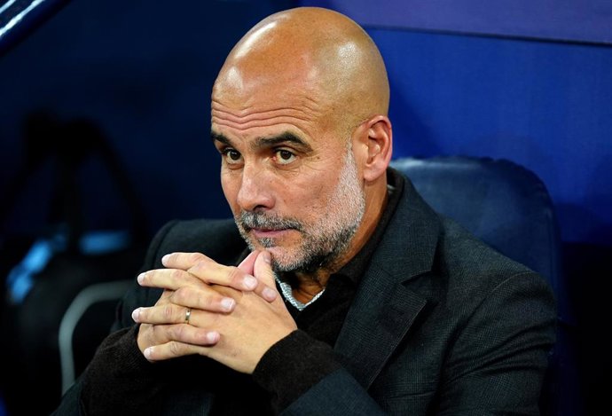 18 September 2025, United Kingdom, Manchester: Manchester City manager Pep Guardiola sits ahead of the UEFA Champions League league soccer match between Manchester City and SSC Neapel at Etihad Stadium. Photo: Mike Egerton/PA Wire/dpa