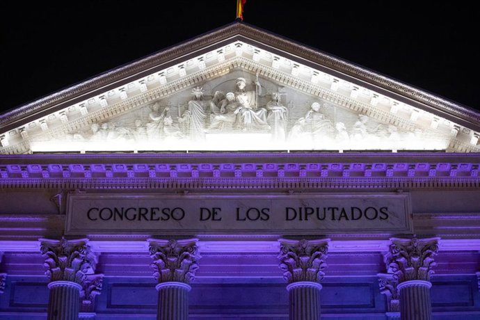 Archivo - La fachada del Congreso de los Diputados iluminada de color morado, a 25 de noviembre de 2023, en Madrid (España). 