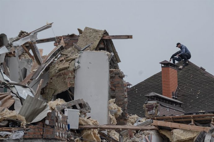 September 29, 2025, Kyiv, Oblast Region, Ukraine: A man surveys damage on a chimney in the aftermath of a Russian attack on Ukraine.
