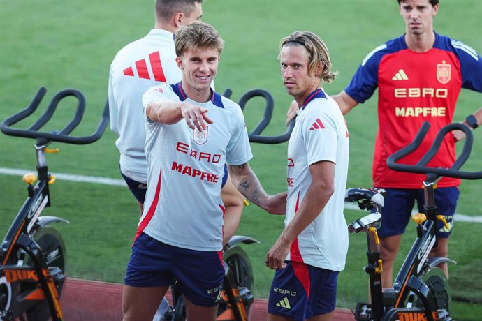 Pablo Barrios and Marcos Llorente of Spain, gesture during a training session prior to the 2026 World Cup qualifying matches against Georgia and Bulgaria, at the Ciudad del Futbol, on October 7, 2025, in Las Rozas, Madrid, Spain.
