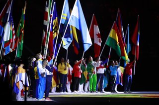 Archivo - 11 August 2019, Peru, Lima: Athletics hold national flags as they take part in the closing ceremony of the Pan American Games Lima 2019. Photo: -/NOTIMEX/dpa