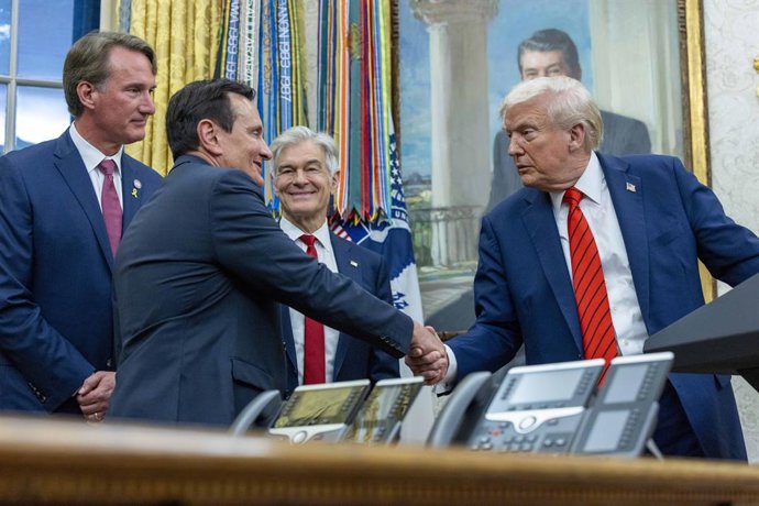 October 10, 2025, Washington, District Of Columbia, USA: United States President Donald J Trump shakes hands with Pascal Soriot, Chief Executive Officer (CEO) of AstraZeneca  following the announcement of a drug pricing deal during a press conference in t