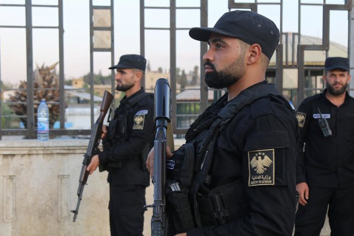 DAMASCUS, Oct. 7, 2025  -- Members of the Internal Security Command stand guard at the outskirts the Kurdish-held neighborhoods of Sheikh Maqsoud in Aleppo, Syria, on Oct. 7, 2025. Syria's chief of defense authorities said Tuesday he met with Kurdish-led 