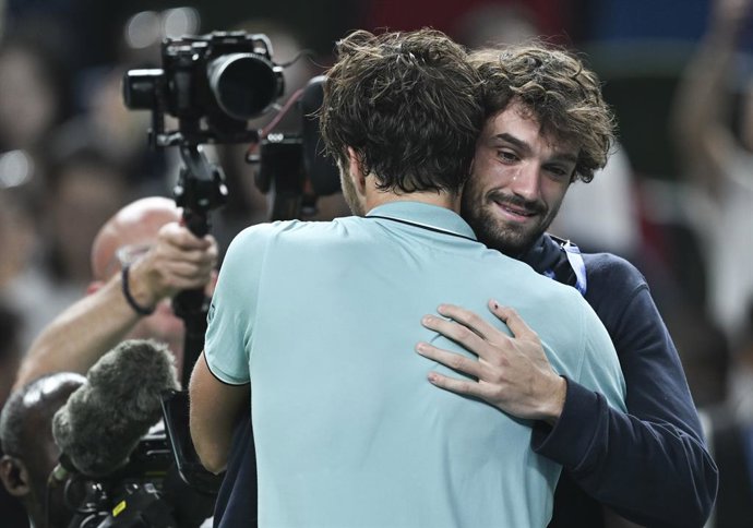 SHANGHAI, Oct. 11, 2025  -- Arthur Rinderknech hugs Valentin Vacherot of Monaco after the men's singles semifinal between Arthur Rinderknech of France and Daniil Medvedev of Russia at the ATP World Tour Shanghai Masters tennis tournament in Shanghai, east