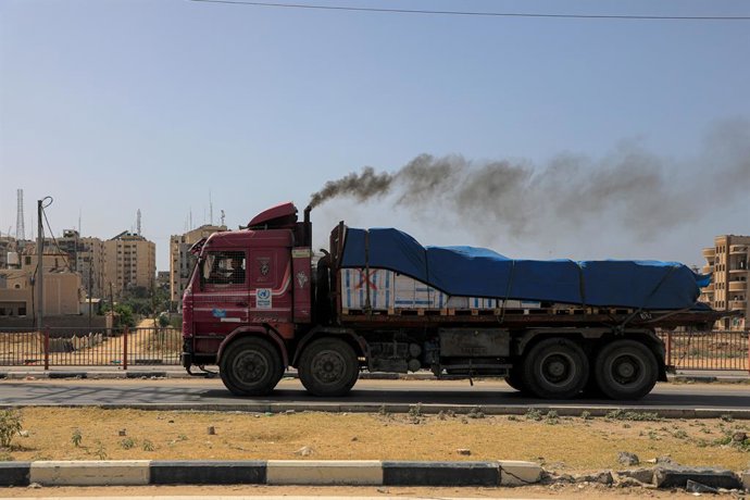 GAZA, May 21, 2024  -- A truck carrying aid is seen in central Gaza Strip, on May 21, 2024. The United Nations Relief and Works Agency for Palestine Refugees (UNRWA) said Monday that land crossings are the most feasible and effective way to deliver aid to