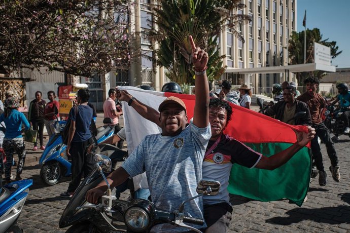 October 13, 2025, Antananarivo, Analamanga, Madagascar: Protesters carry flags on motorcycles and return from ORTM, the national radio and television station, after demanding that its managers vacate the premises and calling for support at Place du 13 Mai