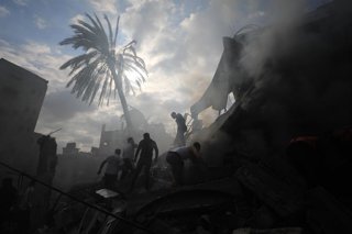 GAZA, Oct. 8, 2025  -- People conduct rescue work amid the rubble of buildings after an Israeli airstrike in the southern Gaza Strip city of Rafah, on Dec. 14, 2023. As Hamas and Israel are meeting in Egypt over a potential ceasefire the world anxiously a