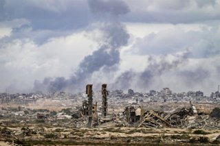 October 9, 2025, Nusairat Camp, Gaza Strip, Palestinian Territory: Smoke rises as Israeli forces attack to prevent them from crossing north through Rashid Street, despite the ceasefire agreement reached and expected to take effect, in Nusairat Camp, Gaza,