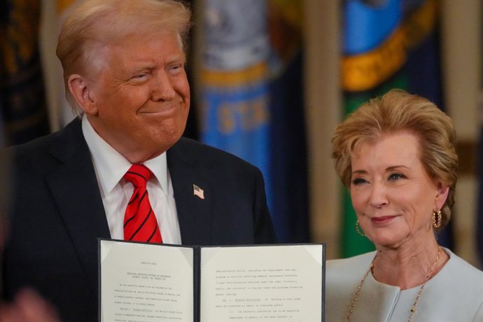 March 20, 2025, Washington, District of Columbia, USA: President DONALD TRUMP signs an executive order alongside Secretary of Education LINDA MCMAHON to start the elimination of the Department of Education during an East Room ceremony.