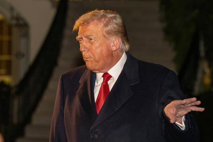 October 24, 2025, Washington, District Of Columbia, USA: President DONALD TRUMP gestures with his hand as he speaks to the media before boarding Marine One on the South Lawn of the White House en route to Malaysia.