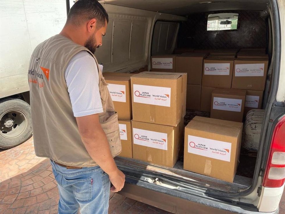 Fatima and Tarek, two parents displaced by conflict, receive vital food assistance at a distribution site in South Lebanon.