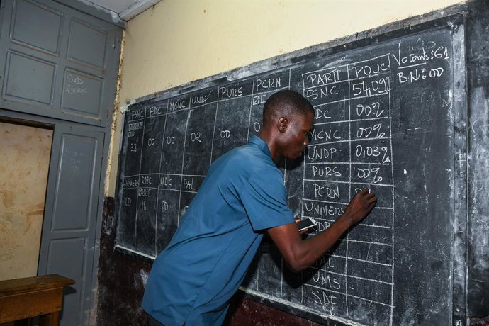 YAOUNDE, Oct. 13, 2025  -- An election official records ballot counts on a blackboard at a polling station in Yaounde, capital of Cameroon, on Oct. 12, 2025.   Voting for Cameroon's presidential election ended on Sunday evening, with ballot counting now u