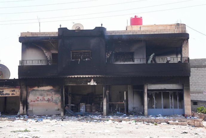 Archivo - Daños en un edificio durante el estallido de violencia sectaria en Sueida, en el sur de Siria