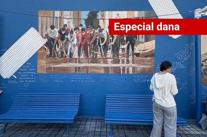 O artista valenciano Escif homenageia os voluntários da dana em um mural em Benetússer (Valência).