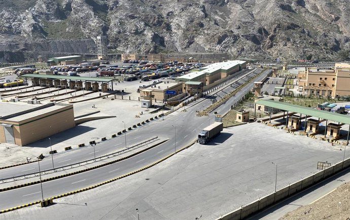 TORKHAM, Oct. 14, 2025  -- This photo taken on Oct. 13, 2025 shows trucks stalled at the Pakistan-Afghanistan Torkham border, amid cross-border clashes in northwest Pakistan's Torkham. Pakistan and Afghanistan clashed in the border area from late Saturday