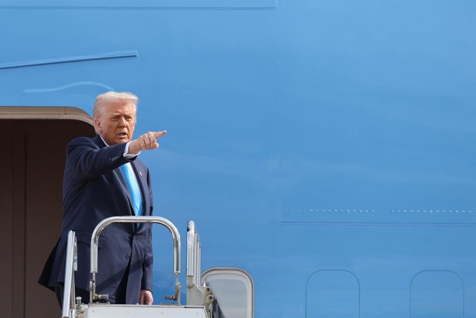 October 28, 2025, Tokyo, Japan: U.S. President Donald Trump gestures as he boards Air Force One for his departure to South Korea, at Haneda Airport in Tokyo, Japan October 29, 2025.
