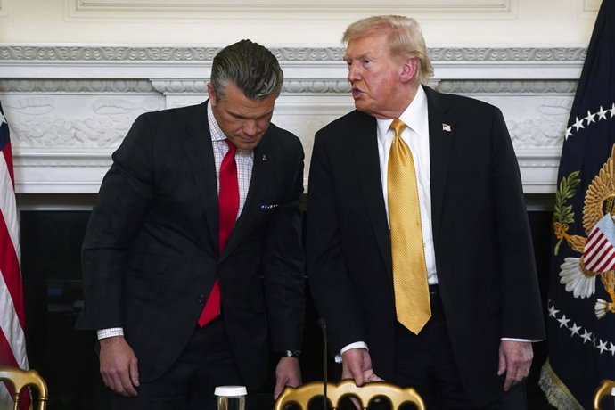 October 23, 2025, Washington, District Of Columbia, USA: United States President Donald Trump (R) and US Secretary of War Pete Hegseth (L) during a roundtable with the Homeland Security Task Force in the State Dining Room of the White House in Washington,