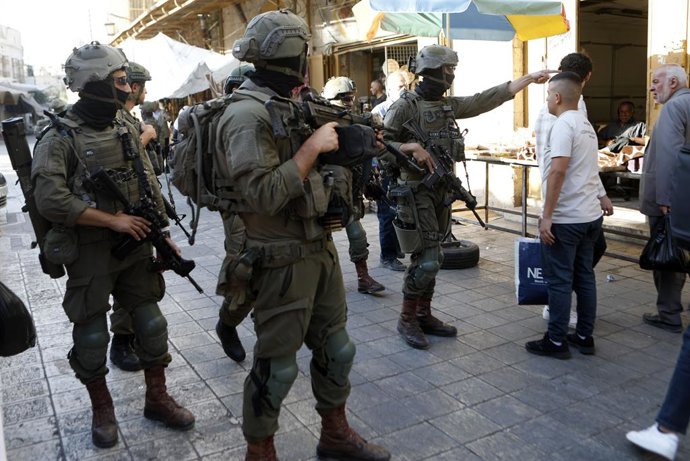 HEBRON, Nov. 2, 2025  -- Members of Israeli forces secure the streets for Israeli settlers in the West Bank city of Hebron, Nov. 1, 2025.