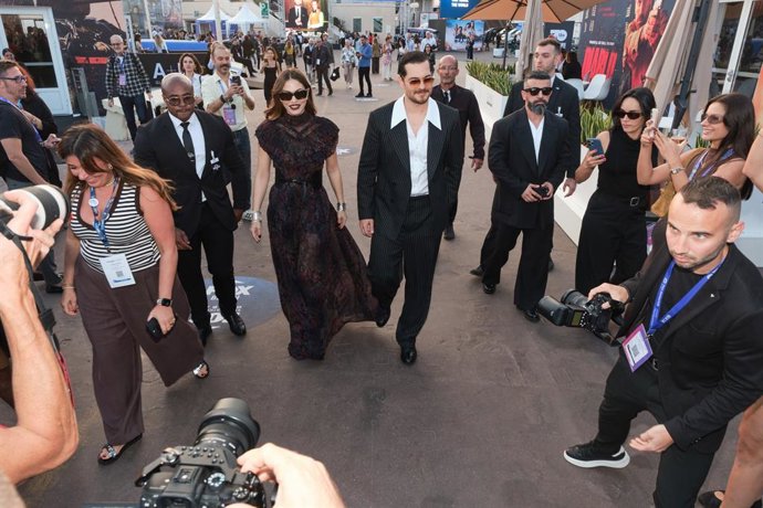 Eshref Ruya lead stars Çağatay Ulusoy and Demet Özdemir arrive at the Palais des Festivals in Cannes