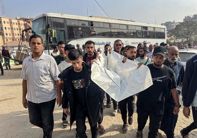November 9, 2025, Khan Yunis, Gaza Strip, Palestinian Territory: People attend the funeral ceremony at Nasser Hospital for eight Palestinians, including six al-Qassam Brigade members, after an Israeli attack on November 9, 2025, in Khan Yunis, Gaza