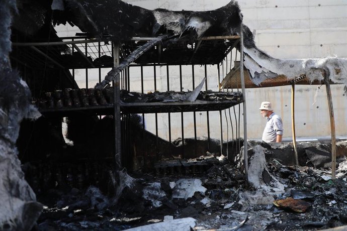 November 12, 2025, Nablus, West Bank, Palestinian Territory: Palestinians inspect burned vehicles and tents at a Bedouin livestock camp and dairy facility after an attack by Jewish settlers west of Nablus in the West Bank, on November 12, 2025. Violence h