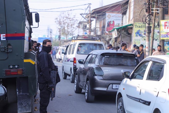 November 15, 2025, Srinagar, Kashmir, India: A Special Operations police officer keeps vigil at a market after an accidental blast occurred when explosives recovered from Faridabad exploded inside Nowgam Police Station in Srinagar. The explosion took plac