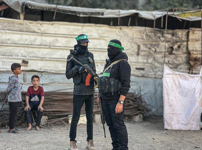October 28, 2025, Nusairat, Gaza Strip, Palestinian Territory: Egyptian Committee teams and members of Hamas military wing, al-Qassam Brigades take part in the search operations for the remains of Israeli hostages in the area where Israel carried out the 