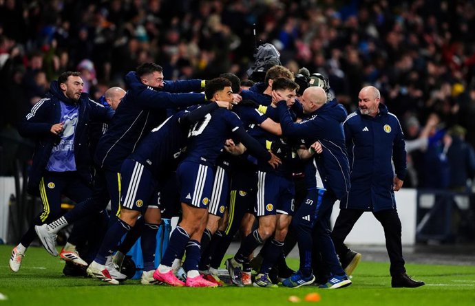 18 November 2025, Scotland, Glasgow: Scotland's Kieran Tierney celebrates scoring his sides third goal with his team mates during the FIFA World Cup European Qualifying match between Scotland and Denmark at Hampden Park, Glasgow. Photo: Andrew Milligan/PA