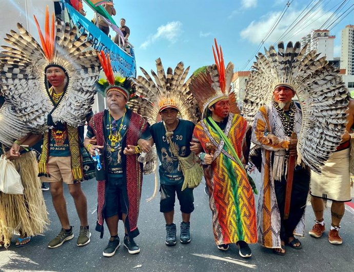 15 November 2025, Brazil, Belem: Indigenous and international climate activists have gathered for a demonstration during the COP30 climate conference. The "March for Climate" is a fight for climate justice and for the defense of ancestral territories of i