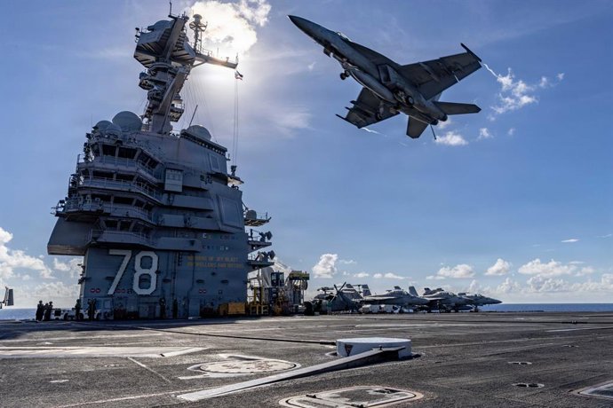 November 13, 2025, Western Atlantic Ocean, International Waters: A U.S Navy F/A-18E Super Hornet fighter aircraft passes overhead of the flight deck of the Ford-class aircraft carrier USS Gerald R. Ford, November 13, 2025 in the Western Atlantic Ocean. U.