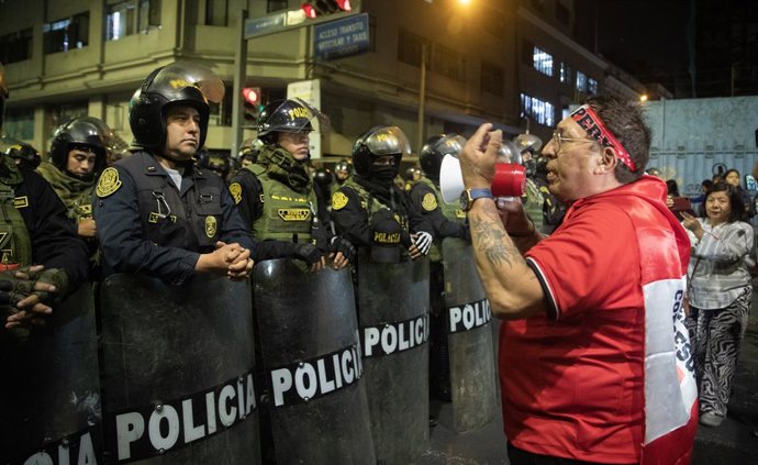 November 14, 2025, Lima, PERU: Peruvian police guard as people march during a protest against the government and the congress