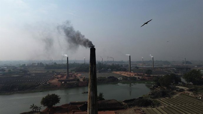 December 1, 2025, Dhaka, Wari, Bangladesh: Smoke is emitting from the chimneys at a brick factory on the outskirts of Dhaka, Bangladesh, on December 02, 2025. These brick factories are contributing to heavy air pollution in Bangladesh. The Air Quality Lif
